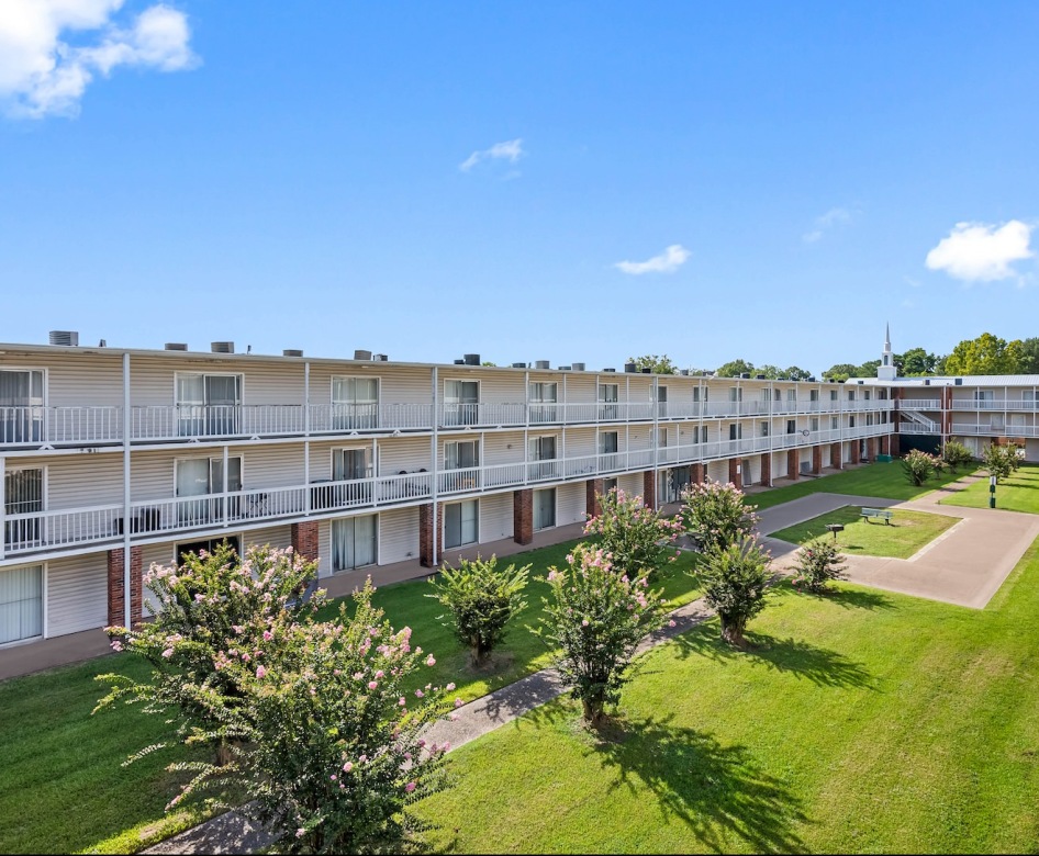 a multi-level building with a courtyard