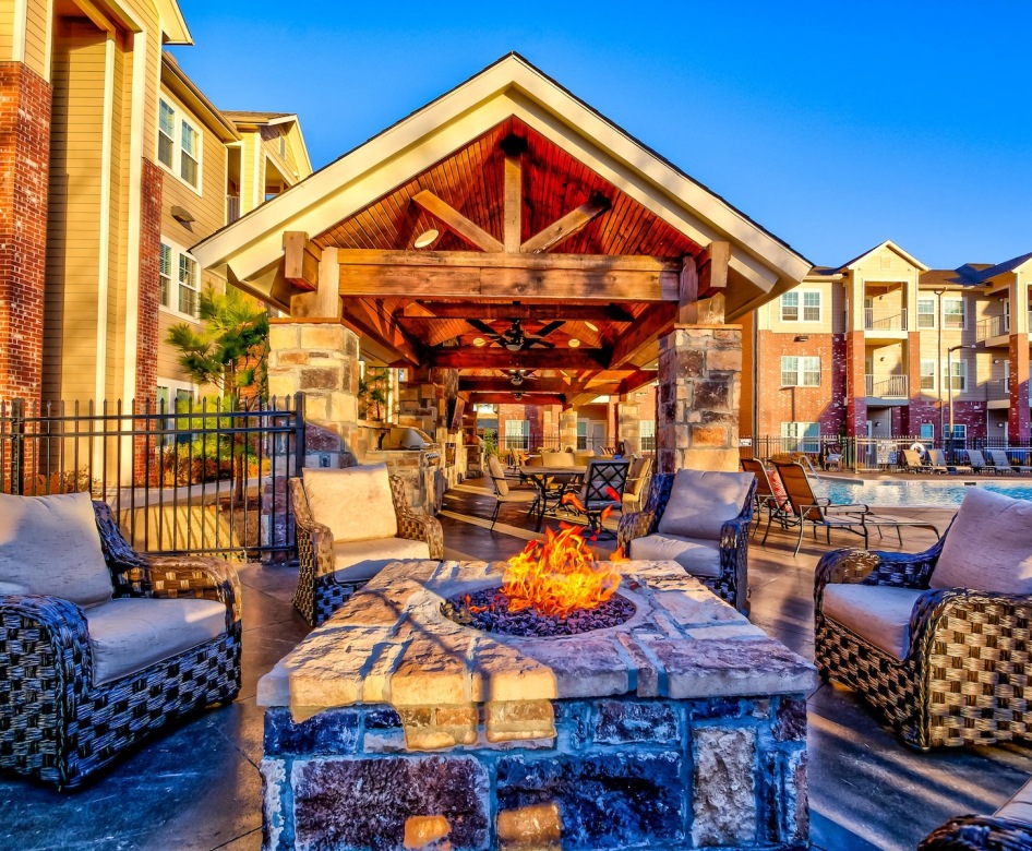 a seating area by a fire pit