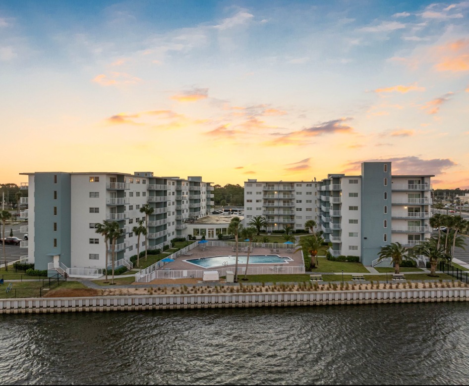 a body of water near a multi-level building