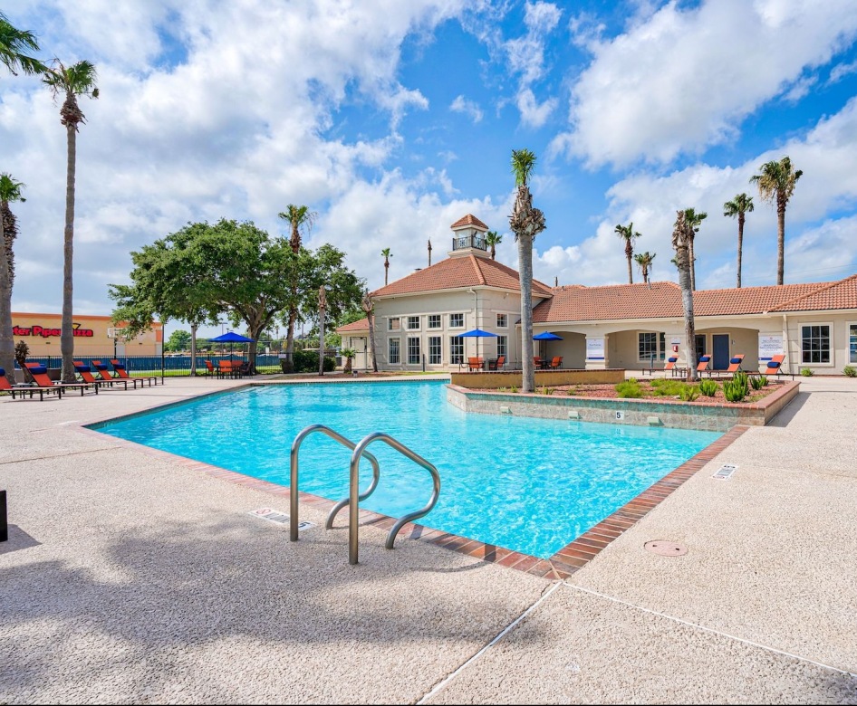 pool with a building behind it
