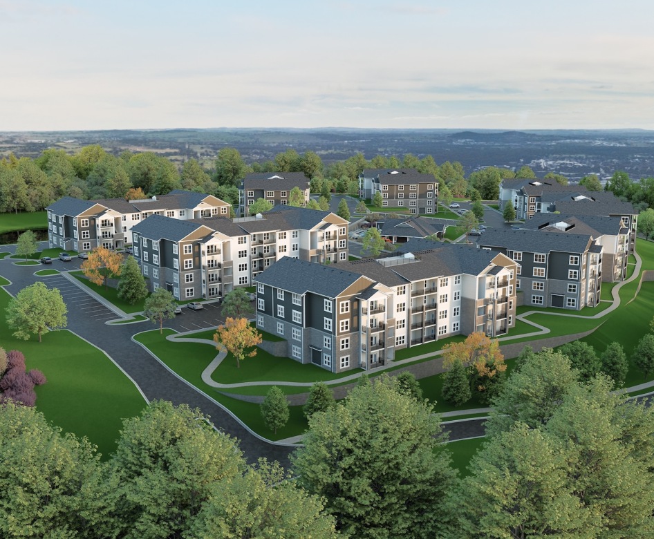 aerial view of apartments amongst several trees