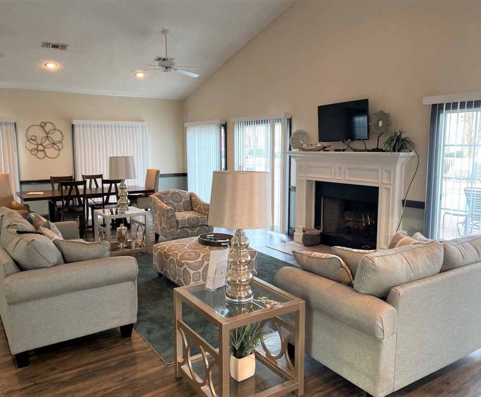 living room with seating fire place and a tv
